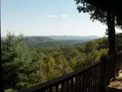 mountain and tree views from log cabin porch
