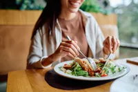 woman eating salad