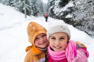Young girls in a snowy forest