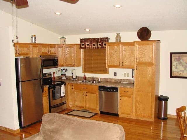 A kitchen with wood cabinets at a vacation rental in Murphy NC.