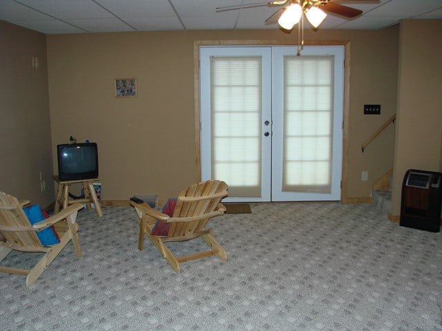 A downstairs room with a TV and chairs in a Murphy NC cabin.