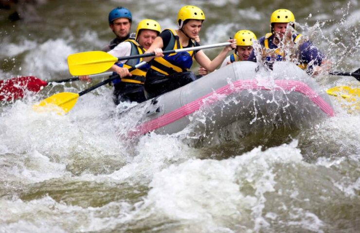 A group of friends white water rafting.