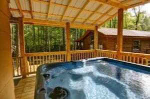 hot tub on deck of on the creek cabin
