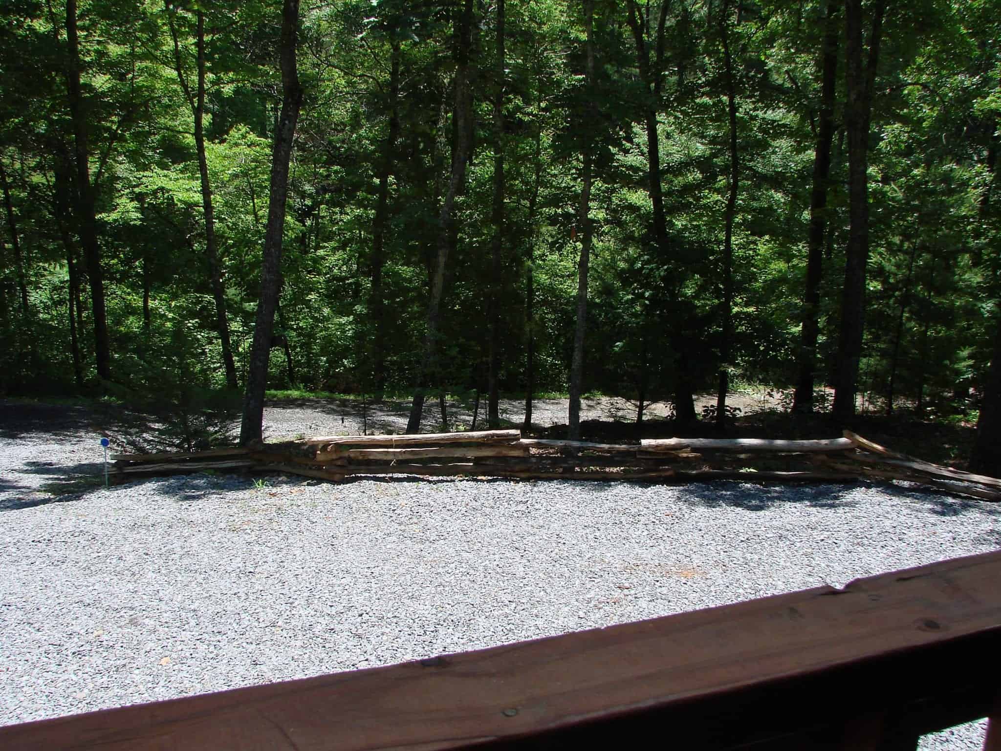 A gravel parking area outside of a cabin rental in Murphy NC.