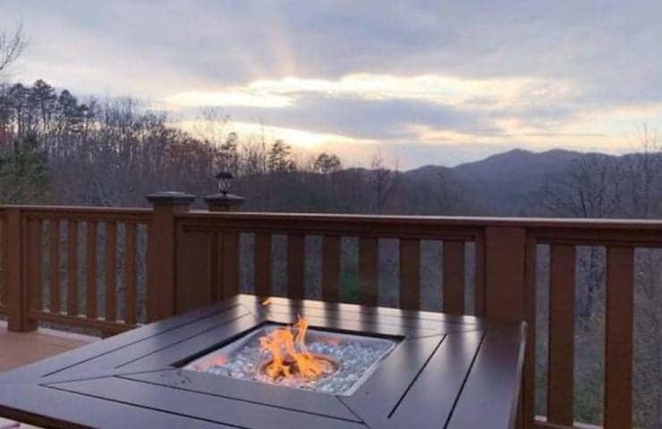 outdoor fire pit on deck of pet friendly cabin