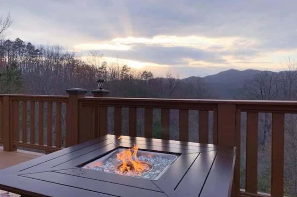 outdoor fire pit on deck of pet friendly cabin