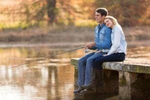 A happy couple fishing near our honeymoon cabins in North Carolina.