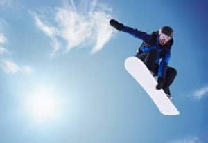 A snowboarder in the air.