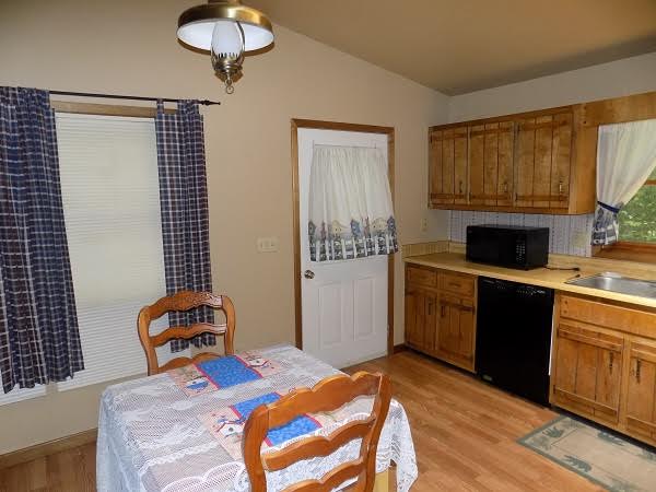 The dining area and kitchen in a charming Murphy NC cabin rental.