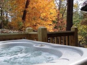 Fall scenery visible from the hot tub on the deck of the Hardwood Trail Retreat cabin in North Carolina.