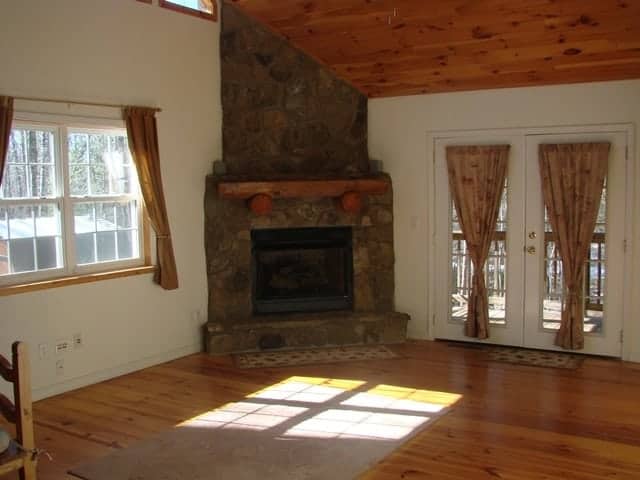 The stone fireplace in a cabin rental in Murphy North Carolina.