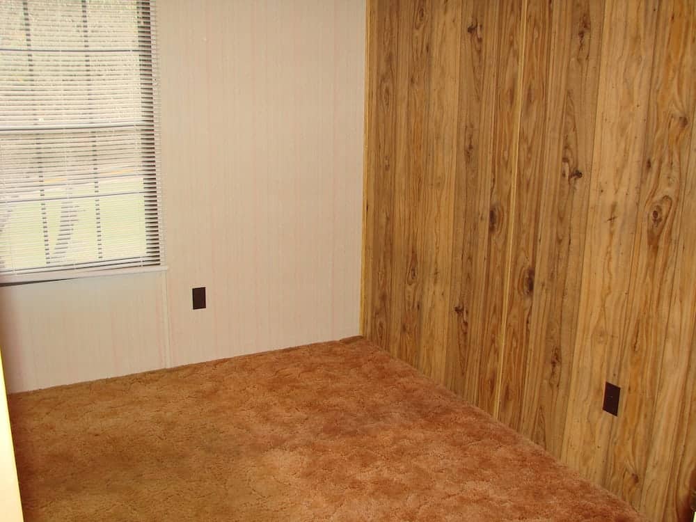 wooden paneling on a wall in an empty room