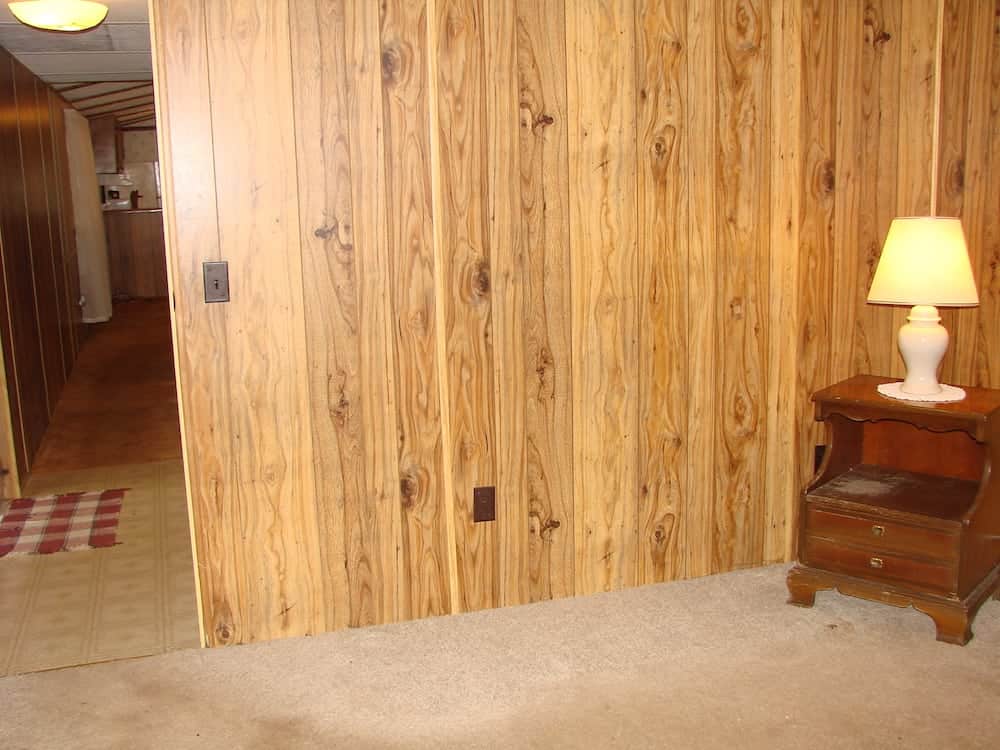 wooden wall with a table in the corner