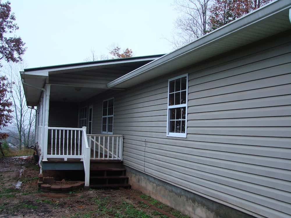 exterior of a gray house with a back porch