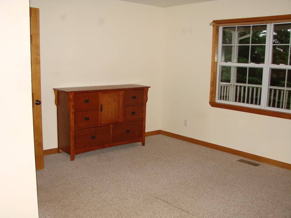 empty room except with a dresser