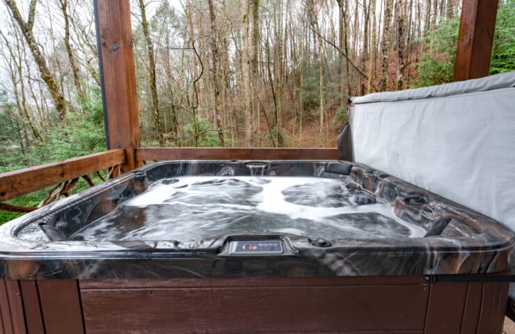 A bubbling hot tub on a cabin deck in Murphy NC.